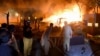 Police and firefighters arrive at the scene of an explosion at a five-star hotel in Quetta, the capital of southwestern Balochistan Province, on April 21.