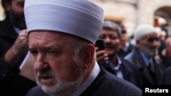 Former Grand Mufti Mustafa Ceric arrives for a ceremony at a mosque in Sarajevo in 2012.