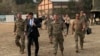 U.S. Defense Secretary Mark Esper (center) walks with Gen. Scott Miller, (right), chief of the U.S.-led coalition in Afghanistan, at the U.S. military headquarters in Kabul on October 20.