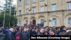 Hundreds of protesters gathered outside the local parliament in Sukhumi on November 15.