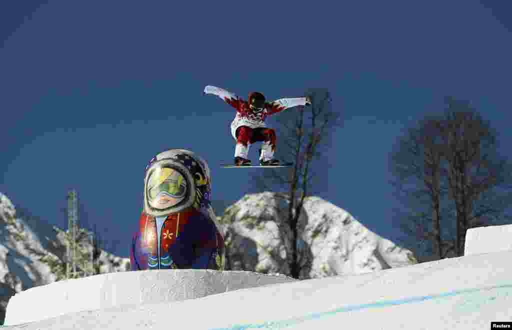 Canadian snowboarder Jenna Blasman trains on the snowboard slopestyle course during practice for the 2014 Sochi Winter Olympics in Russia. (Reuters/Dylan Martinez)