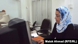 Iraq – woman works on computer, Baghdad, July 2011 