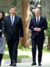 Kancelari gjerman, Olaf Scholz (djathtas) me presidentin kinez, Xi Jinping në Pekin më 16 prill.