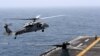 AT SEA -- An MH-60S Sea Hawk lands on the flight deck of USS Boxer (LHD-4) in the Arabian Sea off Oman, July 16, 2019