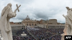 Vatican -- crowd gathered on St Peter's Square for dual canonization of Popes John XXIII and John Paul II on 27apr2014