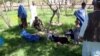 Schoolgirls in Takhar Province receive first aid after the suspected poisoning of their water supply.