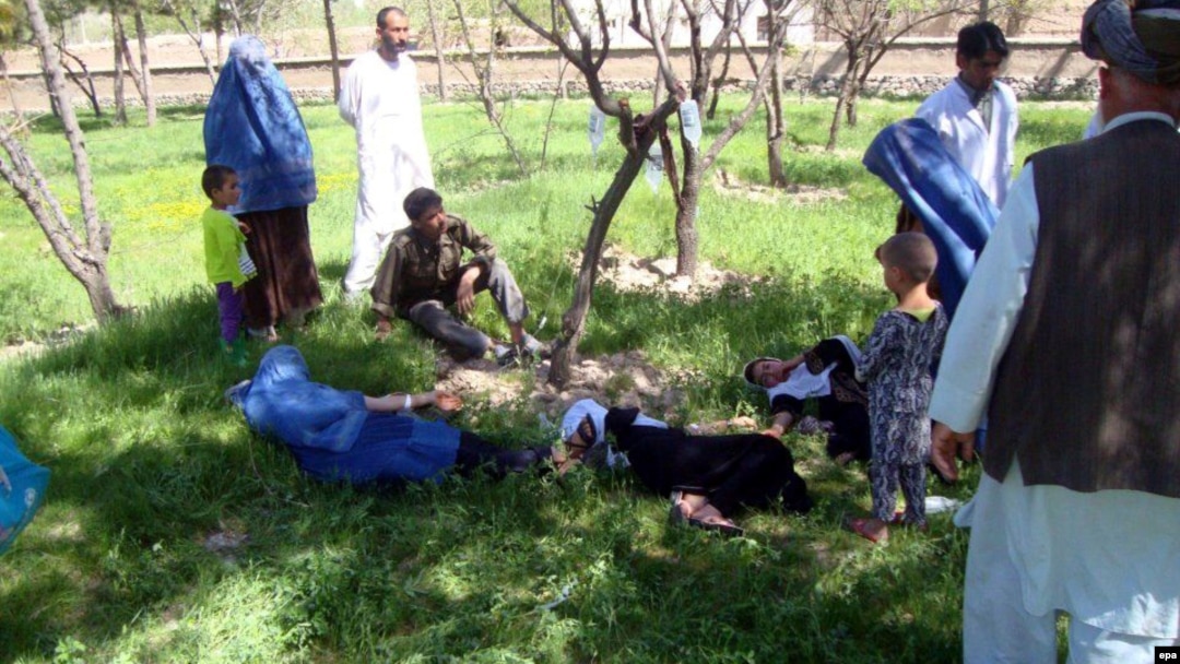 Schoolgirls in Takhar Province receive first aid after the suspected poisoning of their water supply.