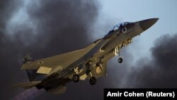 ISRAEL -- FILE PHOTO- An Israeli air force F-15 fighter jet flies during an exhibition as part of the graduation ceremony of air force pilots at Hatzerim air base in southern Israel June 25, 2015.