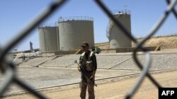 A security guard at the Tawke oil refinery near the village of Zacho, in Iraqi Kurdistan