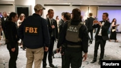 Guests are evacuated from the ballroom.