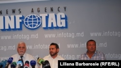 The so-called Ilascu group -- Andrei Ivanțoc, Tudor Popa, and Ștefan Urîtu (left to right) -- at a news conference on August 10.