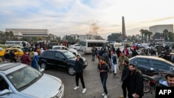 People celebrate at Umayyad Square in Damascus on December 8, 2024, after rebel forces claimed to have ousted President Bashar al-Assad. 