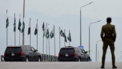 A convoy heads toward the Serena Hotel as delegations from the United States and Iran prepare for peace talks in Islamabad on April 11.