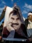 Supporters in Diyarbakir, Turkey, hold a banner of Kurdish leader Abdullah Ocalan as they celebrate his peace call on February 28.