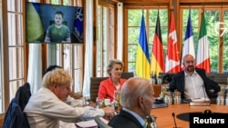 Ukrainian President Volodymyr Zelenskiy addresses Group of Seven leaders and EU representatives via video link at the G7 summit in Germany on June 27.