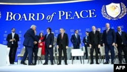 US President Donald Trump shakes hands with Argentinian President Javier Milei at the Board of Peace meeting at the World Economic Forum in Davos on January 22. 
