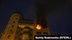 A fire burns in an apartment building hit by a Russian strike in the early hours of July 10. 