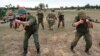 Стоп кадър от видео, публикувано от беларуското министерство на отбраната на 14 юли, на което се вожда как беларуски войници се обучават с бойци на "Вагнер" близо до Цел, на около 90 километра югоизточно от Минск, Беларус.