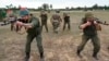 In this photo taken from video released by Belarusian Defense Ministry on July 14, Belarusian soldiers attend training with Wagner fighters near Tsel, about 90 kilometers southeast of Minsk, Belarus. 