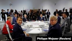 French President Emmanuel Macron, U.S. President Donald Trump and other Western leaders meeting in France on August 25, 2019.