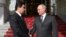 Russian President Vladimir Putin (right) and Turkmen President Gurbanguly Berdymukhammedov meet in Ashgabat on October 2.