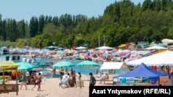 It seems like locals around Lake Issyk-Kul will vote for the ruling parties. There are new buildings everywhere, restaurants, stores, boutiques, and a line of recently built hotels right down by the water that block the view of the beach.