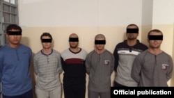 Задержанные подозреваемые на фото, распространенном пресс-службой комитета национальной безопасности (КНБ) Казахстана 14 января 2019 года.