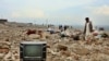 A man looks for his belongings after a heavy flood in the Charikar city of Parwan Province north of Kabul.