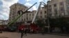 Ukrainian rescuers clear the rubble of a residential building partially destroyed as a result of a missile attack in Dnipro on April 19.