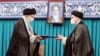 Iranian Supreme Leader Ayatollah Ali Khamenei (left) gives his official seal of approval to newly elected President Ebrahim Raisi in an endorsement ceremony in Tehran on August 3. 