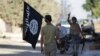 Syria -- A rebel fighter takes away a flag that belonged to Islamic State militants in Akhtarin village, after rebel fighters advanced in the area, in northern Aleppo Governorate, October 7, 2016