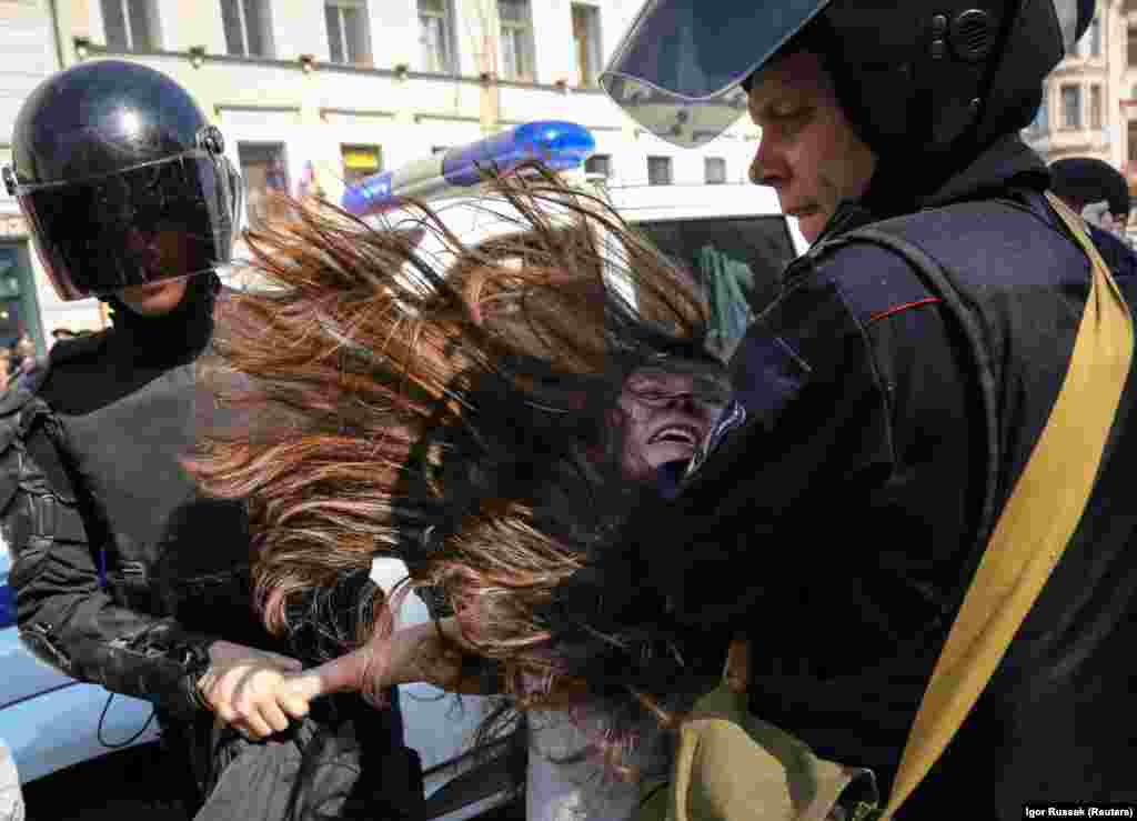 Russian police detain an opposition protester during a May Day rally in St. Petersburg on May 1. (Reuters/Igor Russak)