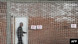 Kosovo -- A Kosovo Albanian man leaves a polling station in Pristina on November 3, 2013. 