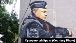 Painted stencil-style lettering appeared on the mural on an apartment building in Simferopol on May 21.