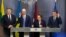 Lithuanian Prime Minister Algirdas Butkevicius (left to right), Ukranian Prime Minister Arseniy Yatsenyuk, Latvian Prime Minister Laimdota Straujuma, and Estonian Prime Minister Taavi Roivas speak to the press after their meeting in Riga on November 5. 