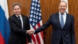 U.S. Secretary of State Antony Blinken (left) and Russian Foreign Minister Sergei Lavrov shake hands before a meeting on January 21, 2022, in Geneva. 