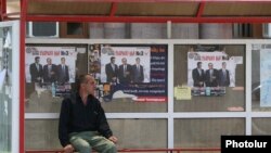 Armenia -- A bus stop in Yerevan plastered with opposition campaign posters.