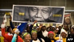 South Africa -- People arrive at the stadium before the memorial service for Nelson Mandela at Soccer City Stadium in Johannesburg, December 10, 2013