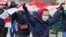 BELARUS - Opposition supporters carry historical white-red-white flags of Belarus as they attend a rally to reject the presidential election results in Minsk, 13dec2020