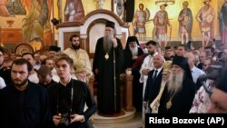 "We do not deny anything that medicine prescribes, we are merely careful," said the new head of the Serbian Orthodox Church in Montenegro, Metropolitan Joanikije II (center). (file photo)