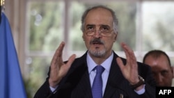 Syrian Ambassador to the United Nations (UN) and head of the government delegation to the peace talks Bashar al-Jaafari gestures as he speaks during a press conference in Geneva on March 16.