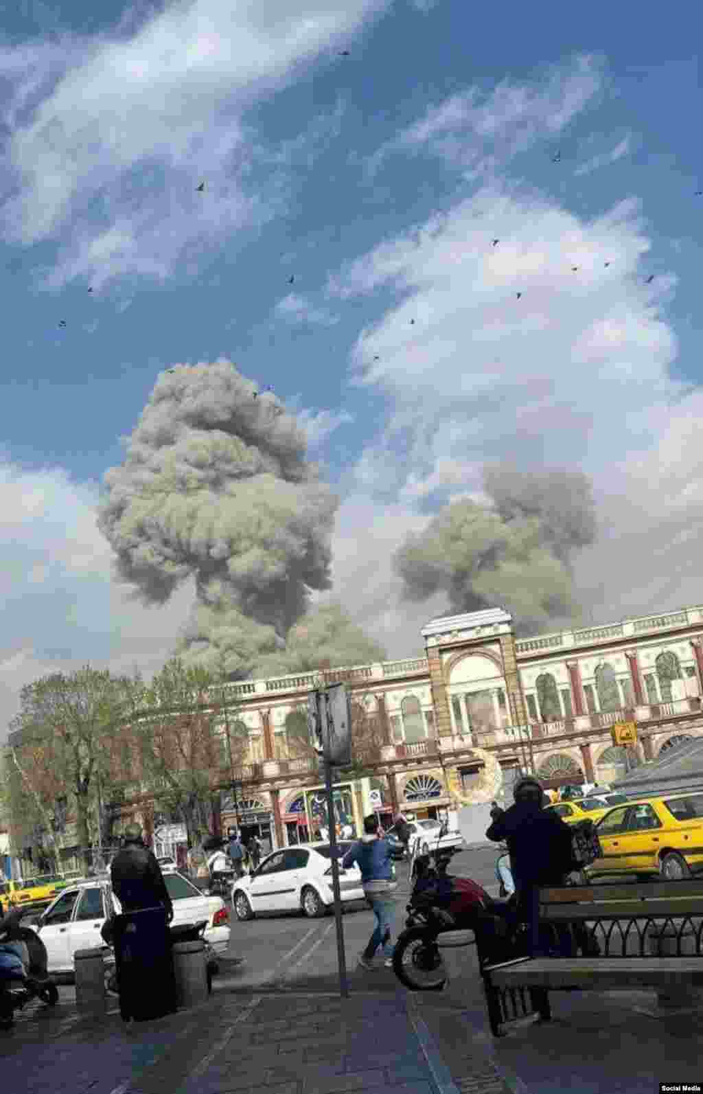 Smoke rises from an explosion in Tehran. 