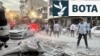People and first-responders gather outside a building that was hit by an Israeli strike in Tehran on June 13, 2025.
