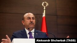 Turkish Foreign Minister Mevlut Cavusoglu gives a press conference following a meeting of the Russian-Turkish joint strategic planning group in Antalya, March 29, 2019