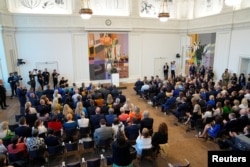 Ukrainian President Volodymyr Zelenskiy speaks to members of the Danish parliament in Copenhagen on August 21.