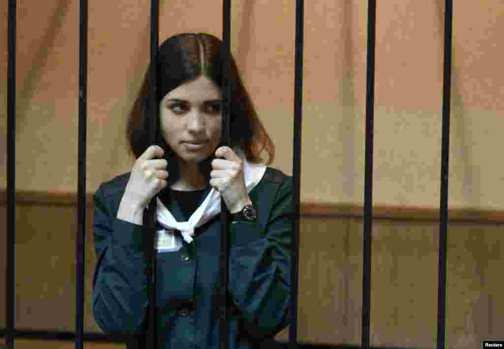 Pussy Riot band member Nadezhda Tolokonnikova looks out from a holding cell during a court hearing on her parole request in the Russian town of Zubova Polyana. Tolokonnikova is appealing her conviction for hooliganism motivated by religious hatred for which she is serving two years in a remote penal colony. (Reuters/Mikhail Voskresensky)