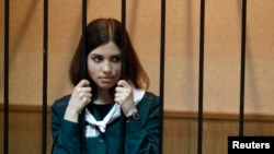 Nadezhda Tolokonnikova looks out from a holding cell during her court hearing on April 26.