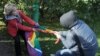 A rights activist (left) is set upon by against an antigay protester during a gay-pride event in St. Petersburg. Russia's "gay propaganda" law has been blamed for unleashing a wave of homophobia across the country.