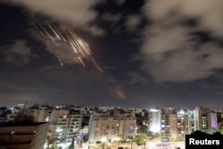 Israel's Iron Dome anti-missile system intercepts rockets, as seen from Ashkelon, Israel, on October 1.