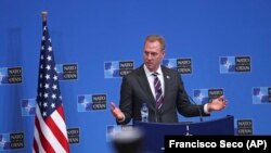 Acting U.S. Defence Secretary Patrick Shanahan talks to journalists during a press conference at the second day of a NATO defense ministers meeting at NATO headquarters in Brussels on February 14.